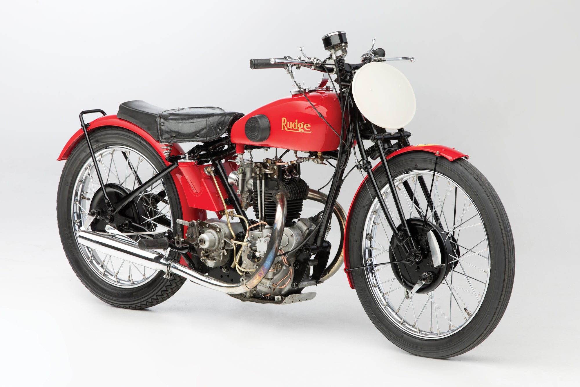 Red motorcycle with visible branding on a white background